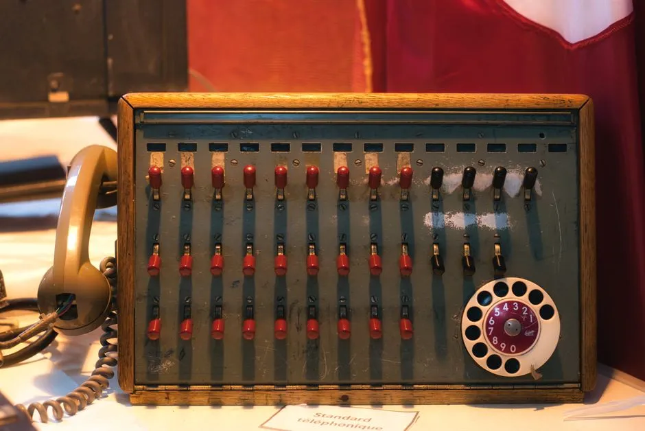 Vintage telephone switchboard with a rotary dial, on museum display